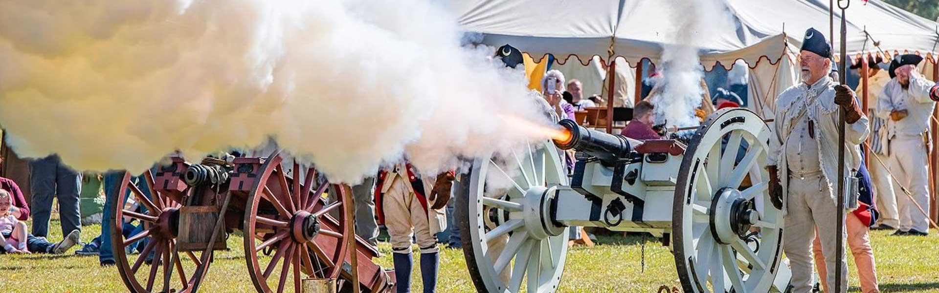 A connon being fired at Historic Camden Revolutionary War Field Days