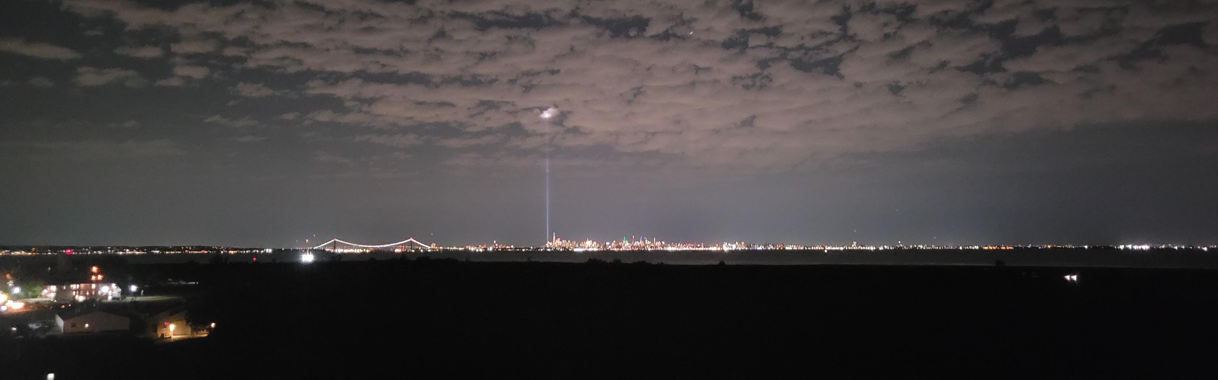 Two beams of light shining into sky