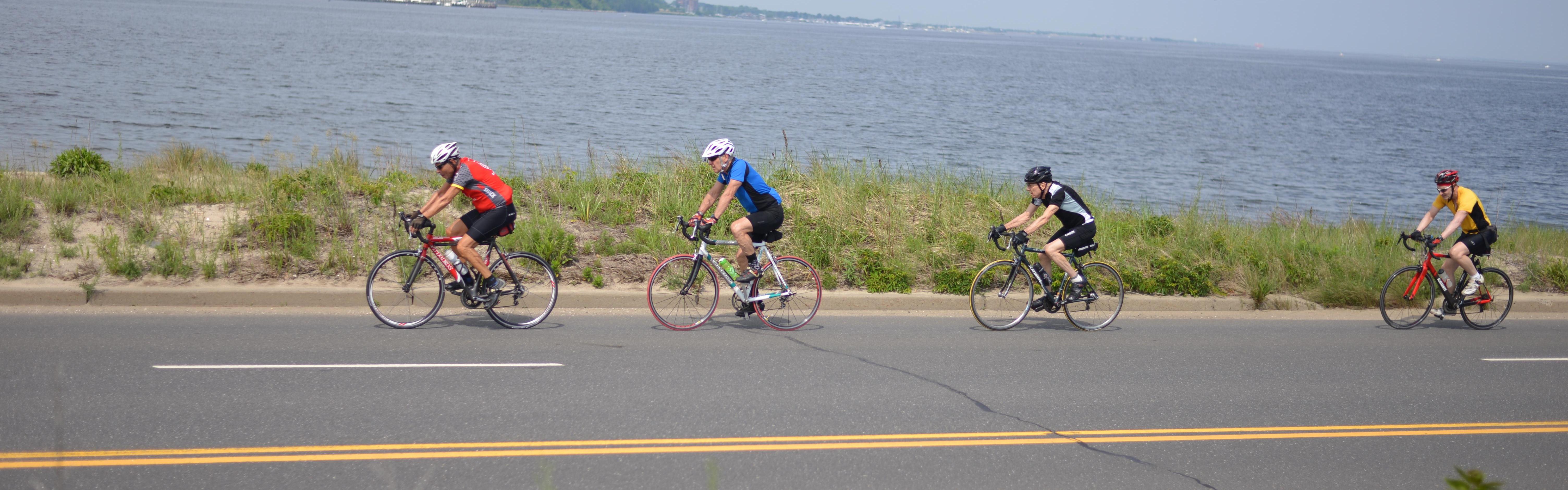 Four cyclists on road