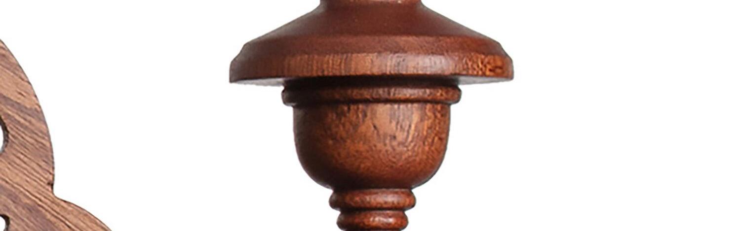 a close up photograph of detail on a carved wooden chair