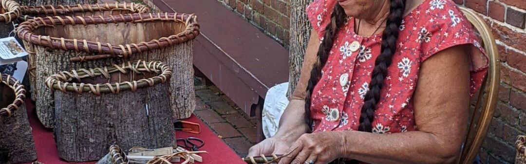 Jennifer Lee demonstrates bark basket weaving in the Revere House courtyard