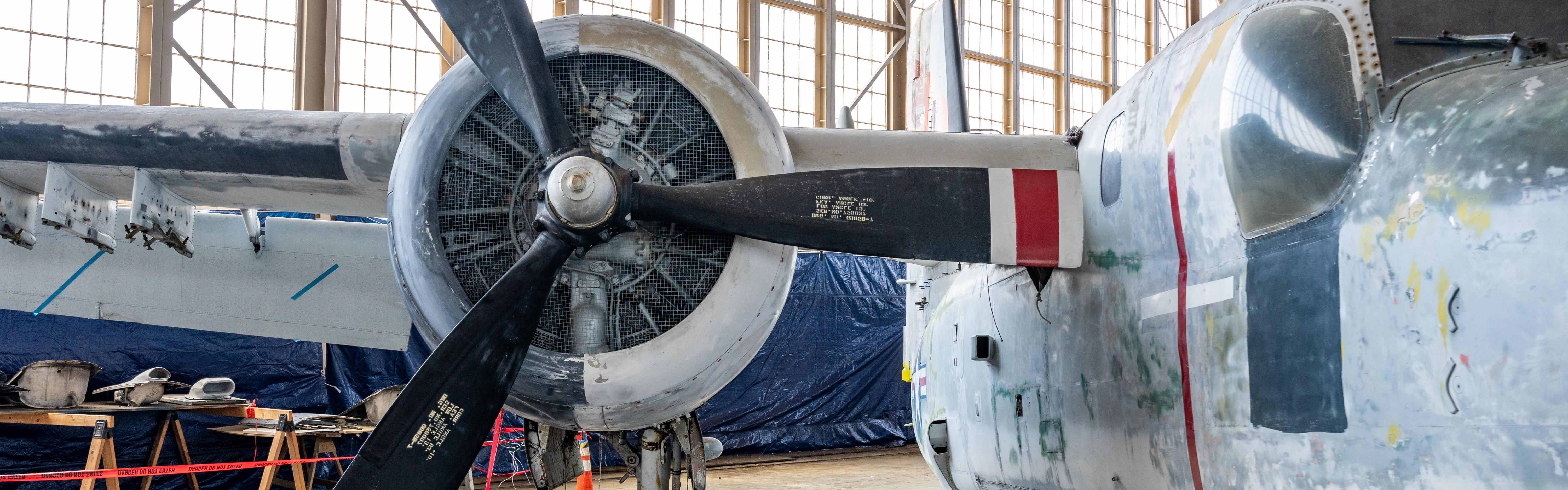 Plane inside historic airplane hangar.