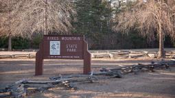 a photo of the entrance sign to Kings Mountain State Park