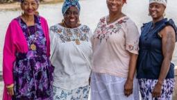 4 women dressed in traditional Gullah garb