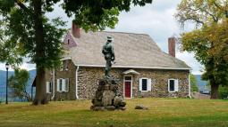 Photograph of Washington's Headquarters in Newburgh, NY with a monument in the foreground