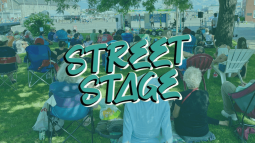 Street Stage graphic with a photo of people sitting on a lawn watching a performance on a stage.