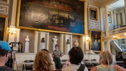 Ranger talking to a group of people in the Great Hall of Faneuil Hall
