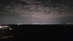 Two beams of light shining into sky