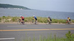 Four cyclists on road