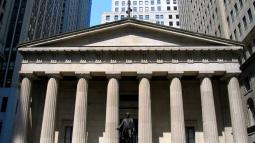 Federal Hall, a gray stone building with columns.