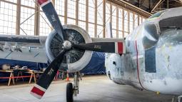 Plane inside historic airplane hangar.