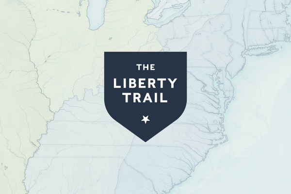 The Liberty Trail Logo over a map of the Eastern Side of the United States