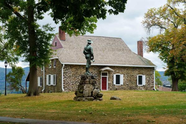 Photograph of Washington's Headquarters in Newburgh, NY with a monument in the foreground
