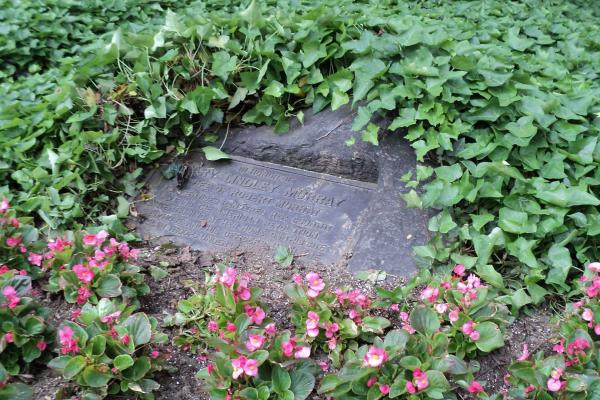 Mary Lindley Murray Monument surrounded by ivy and flowers