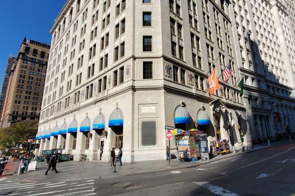 Large, multi-story building on a corner in New York City