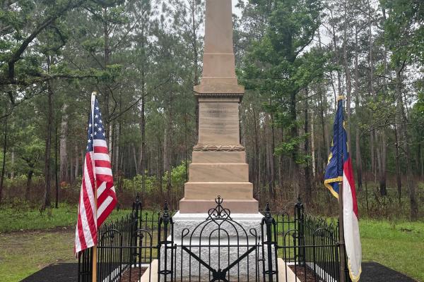 Stone Monument with American and North Carolina Flags