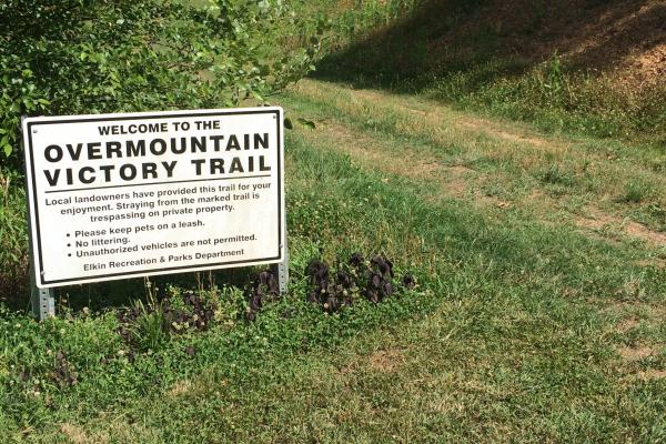 A sign on the Overmountain Victory Trail at Elkin reminds visitors not to stray off the trail.