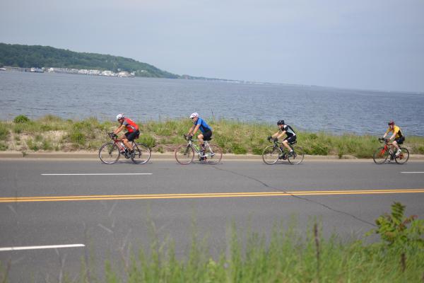 Four cyclists on road