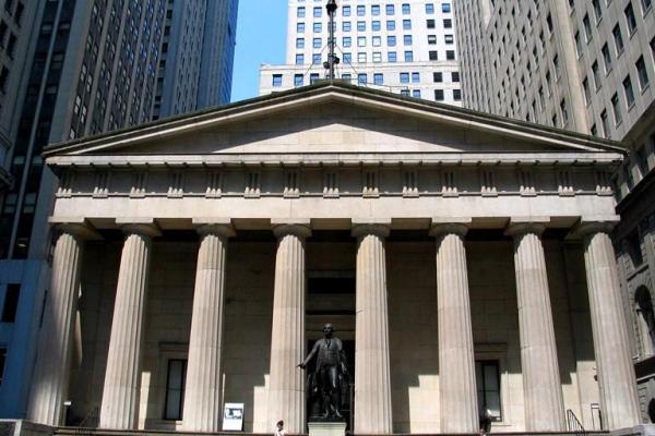 Federal Hall, a gray stone building with columns.