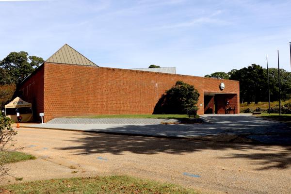the Yorktown Battlefield Visitor Center.   A large brick building with National Park Arrowhead on it