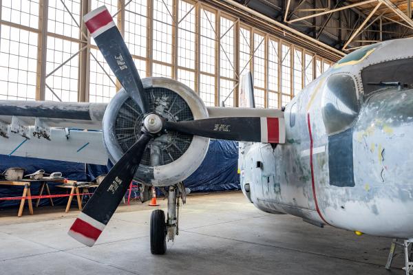 Plane inside historic airplane hangar.