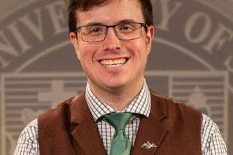 Professional headshot of a young man