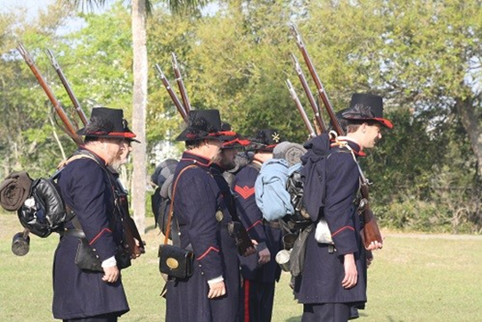 United States soldiers in formation with rifles and gear