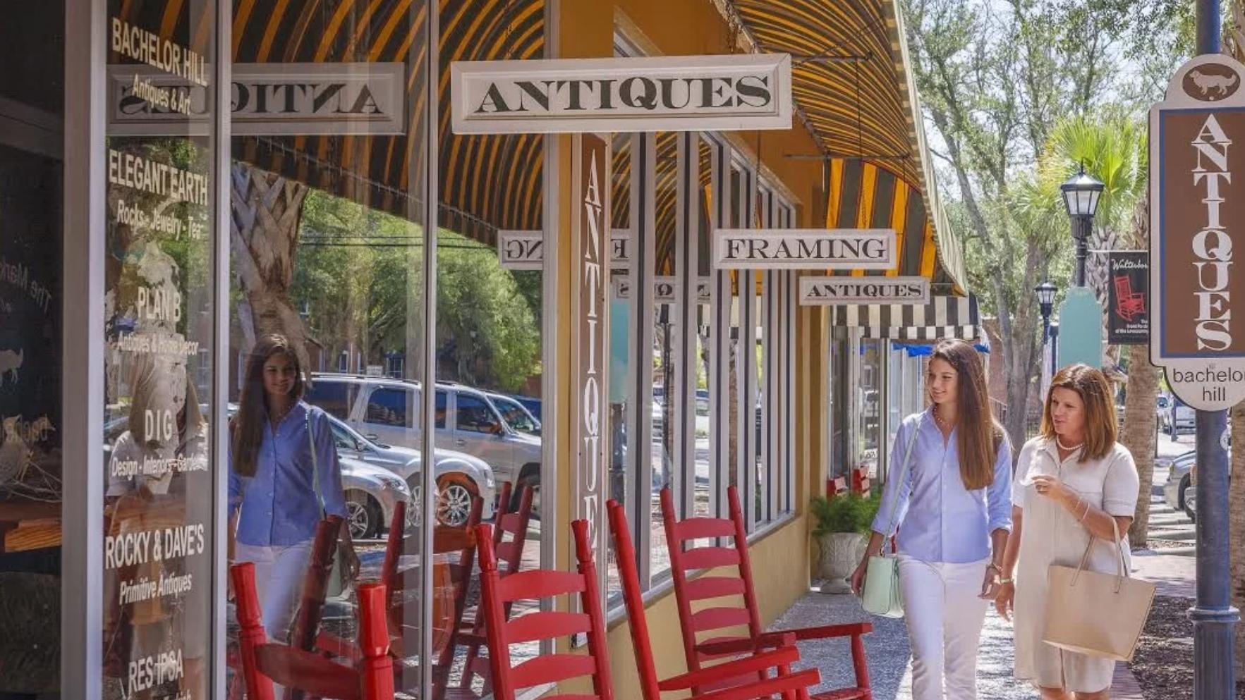 Women walking down a shopping strip looking into windows