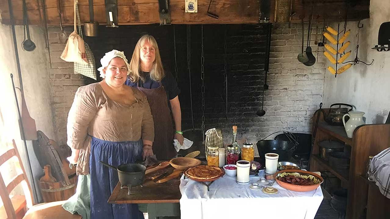 Living historians stand in the historic kitchen at New Bridge Landing in NJ