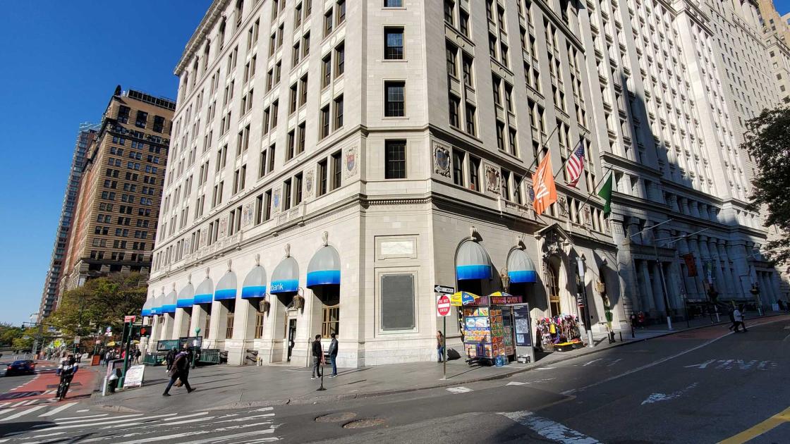 Large, multi-story building on a corner in New York City